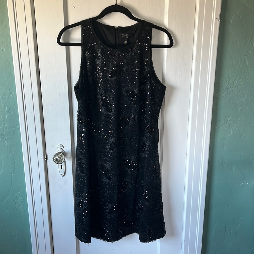 Black woman’s sequenced dress. Size L right above knee if you are at least 5’7.